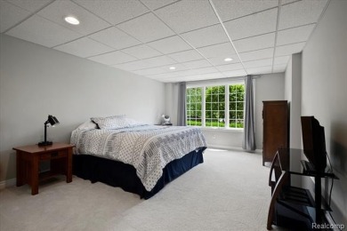 Enjoy maintenance-free golf course living on the first green of on Pine Knob Golf Club - Hawk in Michigan - for sale on GolfHomes.com, golf home, golf lot