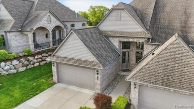 Enjoy maintenance-free golf course living on the first green of on Pine Knob Golf Club - Hawk in Michigan - for sale on GolfHomes.com, golf home, golf lot