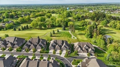 Enjoy maintenance-free golf course living on the first green of on Pine Knob Golf Club - Hawk in Michigan - for sale on GolfHomes.com, golf home, golf lot