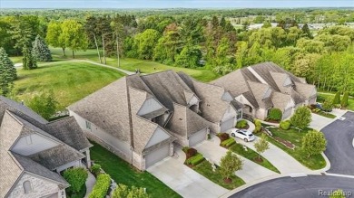 Enjoy maintenance-free golf course living on the first green of on Pine Knob Golf Club - Hawk in Michigan - for sale on GolfHomes.com, golf home, golf lot
