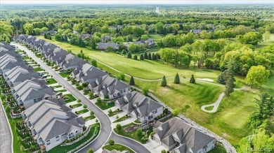 Enjoy maintenance-free golf course living on the first green of on Pine Knob Golf Club - Hawk in Michigan - for sale on GolfHomes.com, golf home, golf lot
