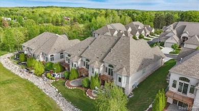 Enjoy maintenance-free golf course living on the first green of on Pine Knob Golf Club - Hawk in Michigan - for sale on GolfHomes.com, golf home, golf lot