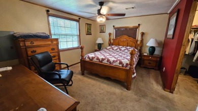 Welcome to your serene sanctuary at 107 Easy Street, nestled in on Lily Lake Golf and RV Resort in Florida - for sale on GolfHomes.com, golf home, golf lot