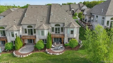 Enjoy maintenance-free golf course living on the first green of on Pine Knob Golf Club - Hawk in Michigan - for sale on GolfHomes.com, golf home, golf lot