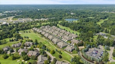 Enjoy maintenance-free golf course living on the first green of on Pine Knob Golf Club - Hawk in Michigan - for sale on GolfHomes.com, golf home, golf lot