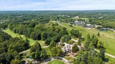 Enjoy maintenance-free golf course living on the first green of on Pine Knob Golf Club - Hawk in Michigan - for sale on GolfHomes.com, golf home, golf lot