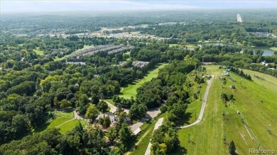 Enjoy maintenance-free golf course living on the first green of on Pine Knob Golf Club - Hawk in Michigan - for sale on GolfHomes.com, golf home, golf lot