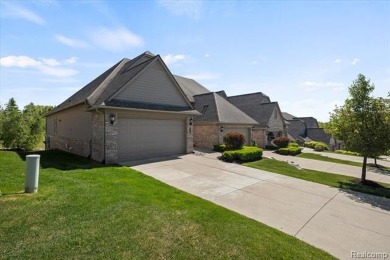 Enjoy maintenance-free golf course living on the first green of on Pine Knob Golf Club - Hawk in Michigan - for sale on GolfHomes.com, golf home, golf lot