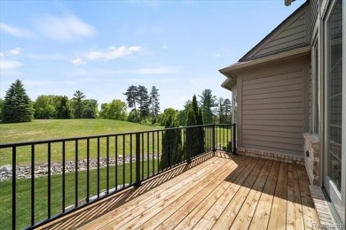 Enjoy maintenance-free golf course living on the first green of on Pine Knob Golf Club - Hawk in Michigan - for sale on GolfHomes.com, golf home, golf lot