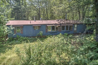 Nestled in the tranquil woods of Calumet on a dead end road on Calumet Golf Course in Michigan - for sale on GolfHomes.com, golf home, golf lot