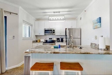 Sitting pretty on the top floor, this beautifully refreshed on Kiva Dunes Golf Club in Alabama - for sale on GolfHomes.com, golf home, golf lot