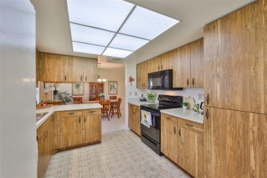 Welcome to this cozy and well-maintained Sunrise II model on Falcon Watch Golf Club in Florida - for sale on GolfHomes.com, golf home, golf lot