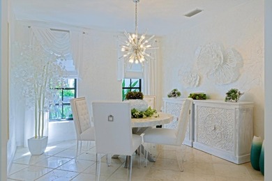 Discover luxury living in the heart of PGA National's on  in Florida - for sale on GolfHomes.com, golf home, golf lot