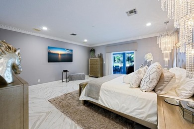 Discover luxury living in the heart of PGA National's on  in Florida - for sale on GolfHomes.com, golf home, golf lot