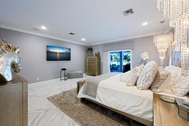 Discover luxury living in the heart of PGA National's on PGA National Golf Club in Florida - for sale on GolfHomes.com, golf home, golf lot