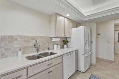 This ADORABLE and meticulously maintained residence is located on Jacaranda West Country Club in Florida - for sale on GolfHomes.com, golf home, golf lot