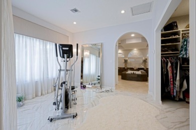 Discover luxury living in the heart of PGA National's on PGA National Golf Club in Florida - for sale on GolfHomes.com, golf home, golf lot