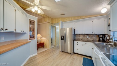 Welcome to effortless SW Florida living in this turnkey on Six Lakes Country Club in Florida - for sale on GolfHomes.com, golf home, golf lot