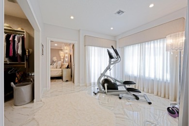 Discover luxury living in the heart of PGA National's on PGA National Golf Club in Florida - for sale on GolfHomes.com, golf home, golf lot