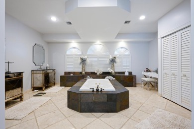 Discover luxury living in the heart of PGA National's on PGA National Golf Club in Florida - for sale on GolfHomes.com, golf home, golf lot