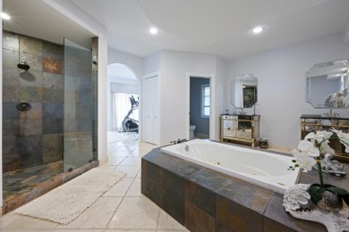 Discover luxury living in the heart of PGA National's on PGA National Golf Club in Florida - for sale on GolfHomes.com, golf home, golf lot