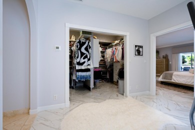Discover luxury living in the heart of PGA National's on PGA National Golf Club in Florida - for sale on GolfHomes.com, golf home, golf lot