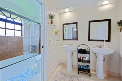 Discover luxury living in the heart of PGA National's on PGA National Golf Club in Florida - for sale on GolfHomes.com, golf home, golf lot