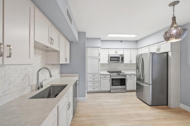 Beautiful waterfront condo in the gated community of Jonathan's on Jonathans Landing Golf Club in Florida - for sale on GolfHomes.com, golf home, golf lot