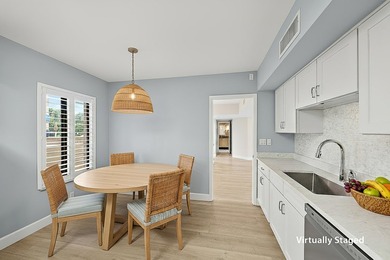 Beautiful waterfront condo in the gated community of Jonathan's on Jonathans Landing Golf Club in Florida - for sale on GolfHomes.com, golf home, golf lot