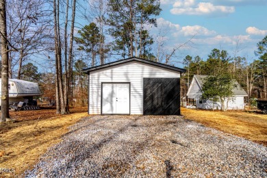 28-Acre Double Lot for Sale with a Meticulously Designed Tiny on River Golf and Country Club at Lake Royale in North Carolina - for sale on GolfHomes.com, golf home, golf lot