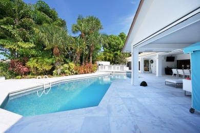 Discover luxury living in the heart of PGA National's on PGA National Golf Club in Florida - for sale on GolfHomes.com, golf home, golf lot