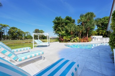 Discover luxury living in the heart of PGA National's on PGA National Golf Club in Florida - for sale on GolfHomes.com, golf home, golf lot