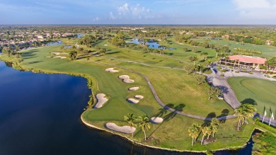 Discover luxury living in the heart of PGA National's on PGA National Golf Club in Florida - for sale on GolfHomes.com, golf home, golf lot