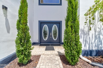 Stunning contemporary architecture frames the wide open interior on Plantation Bay Golf and Country Club in Florida - for sale on GolfHomes.com, golf home, golf lot
