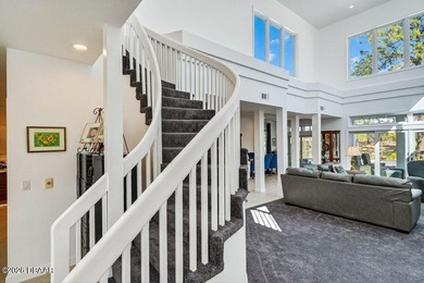 Stunning contemporary architecture frames the wide open interior on Plantation Bay Golf and Country Club in Florida - for sale on GolfHomes.com, golf home, golf lot