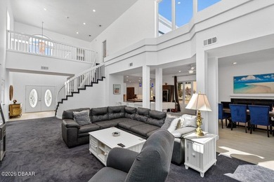 Stunning contemporary architecture frames the wide open interior on Plantation Bay Golf and Country Club in Florida - for sale on GolfHomes.com, golf home, golf lot