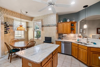 Discover unparalleled luxury in this charming villa nestled on a on Viera East Golf Club in Florida - for sale on GolfHomes.com, golf home, golf lot