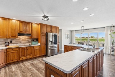 This beautifully updated rancher is a true gem--backing right up on Desert Hawk At Pueblo West in Colorado - for sale on GolfHomes.com, golf home, golf lot