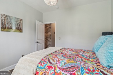 Imagine retreating to your spacious master suite on the main on Black Creek Golf Club in Georgia - for sale on GolfHomes.com, golf home, golf lot