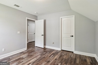 Imagine retreating to your spacious master suite on the main on Black Creek Golf Club in Georgia - for sale on GolfHomes.com, golf home, golf lot