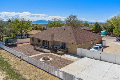 This beautifully updated rancher is a true gem--backing right up on Desert Hawk At Pueblo West in Colorado - for sale on GolfHomes.com, golf home, golf lot