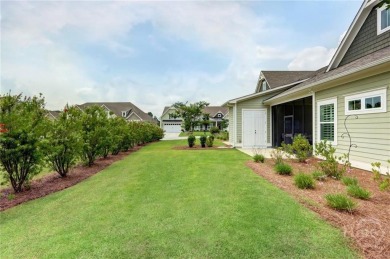 This lovely paired home just inside the main gate offers the on Savannah Quarters Country Club in Georgia - for sale on GolfHomes.com, golf home, golf lot