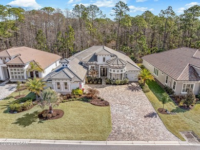 Experience luxury living at its finest in this exceptional 2023 on Plantation Bay Golf and Country Club in Florida - for sale on GolfHomes.com, golf home, golf lot