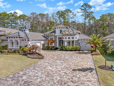 Experience luxury living at its finest in this exceptional 2023 on Plantation Bay Golf and Country Club in Florida - for sale on GolfHomes.com, golf home, golf lot