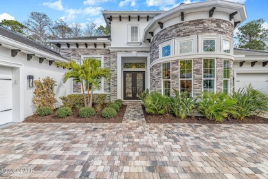 Experience luxury living at its finest in this exceptional 2023 on Plantation Bay Golf and Country Club in Florida - for sale on GolfHomes.com, golf home, golf lot