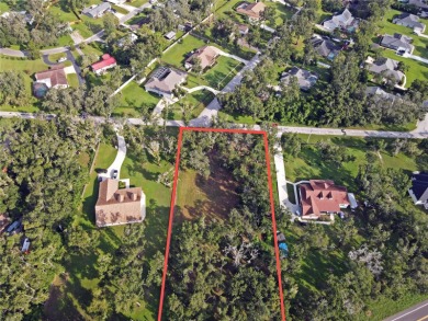 Build your private estate on 1.2 acres in the rolling hills of on Lake Jovita Golf and Country Club in Florida - for sale on GolfHomes.com, golf home, golf lot