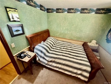 Cozy 3-Bedroom, 2-Bath Cabin in Lower Moonridge, Big Bear Lake
 on Big Bear Mountain Ski and Golf Resort in California - for sale on GolfHomes.com, golf home, golf lot