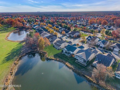 Extended Heritage model with full loft sits on a lakefront lot on Westlake Golf and Country Club in New Jersey - for sale on GolfHomes.com, golf home, golf lot