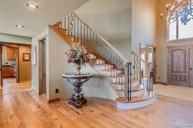 Nestled on a world-class golf course, this beautifully crafted on Prestwick Village Golf Club in Michigan - for sale on GolfHomes.com, golf home, golf lot