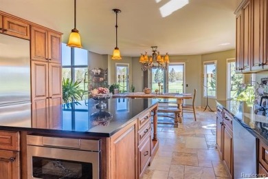 Nestled on a world-class golf course, this beautifully crafted on Prestwick Village Golf Club in Michigan - for sale on GolfHomes.com, golf home, golf lot